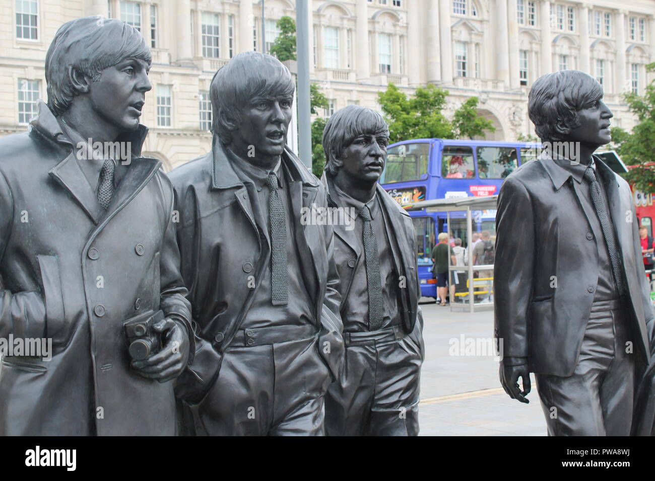 The Beatles Statue In Liverpool Albert Dock. Famous Monument To John ...