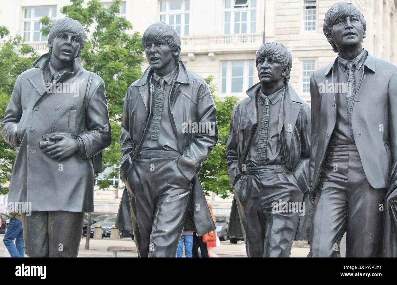 The Beatles Statue In Liverpool Albert Dock. Famous Monument To John ...