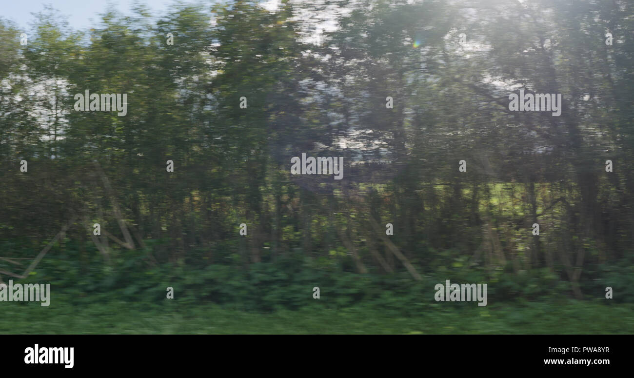 motion blur background side view of mixed rural landscape in early ...