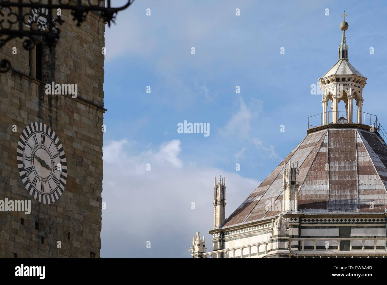 Clock of the Campanile; bell tower and the top of the Baptistery of San Giovanni in Corte; Piazza Duomo; Duomo Square; Pistoia; Tuscany; Italy; Europe Stock Photo