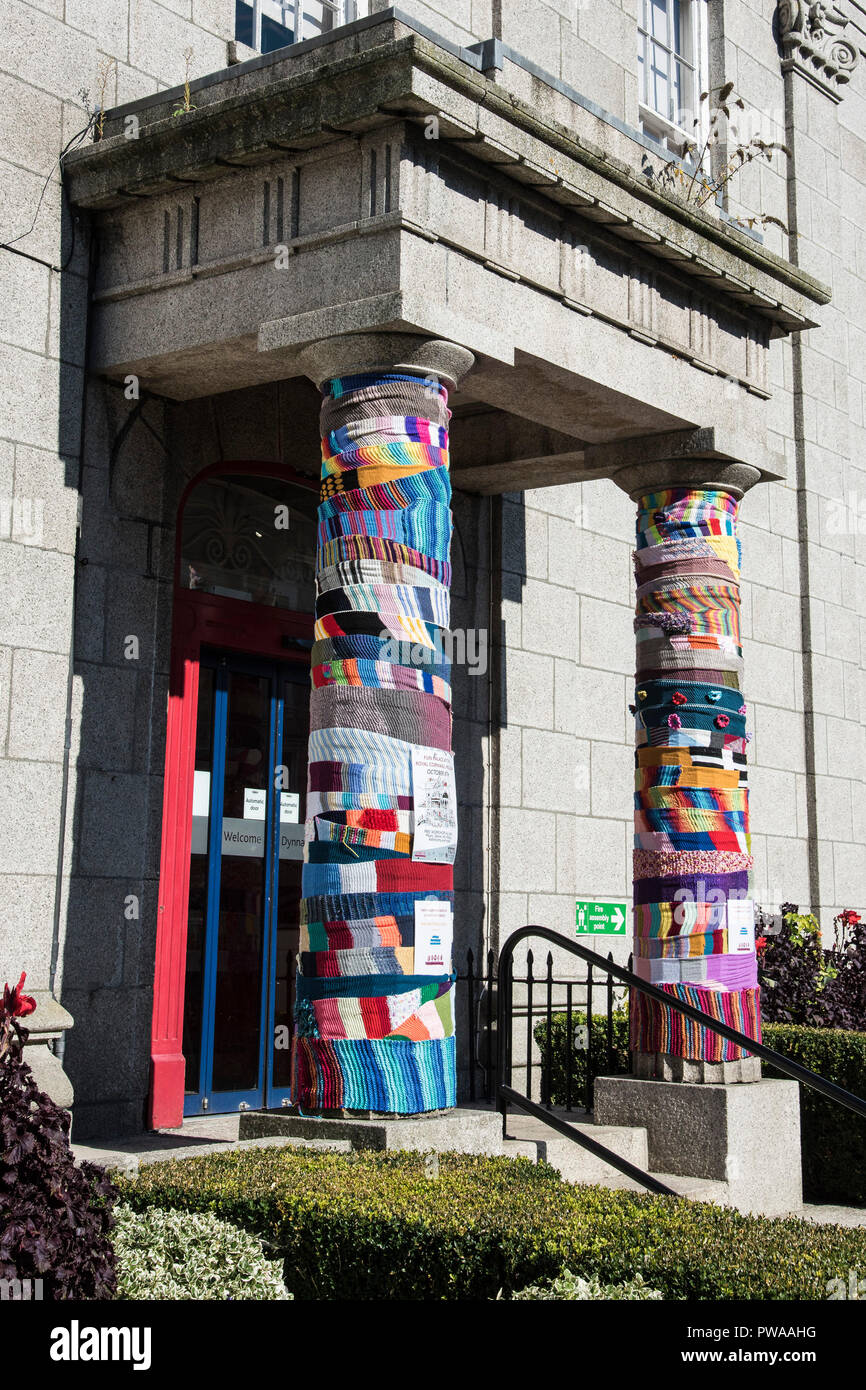 Yarn bombing on the pillars at the entrance to Truro Museum in Cornwall in the UK. Stock Photo