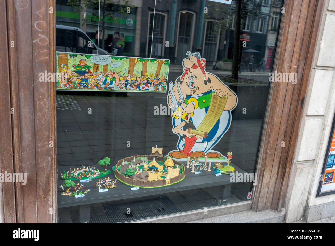 Brussels, Belgium - April 14 : Photo of Asterix and Obelix displayed in a shop window on april 14 in Brussels, Belgium. Stock Photo
