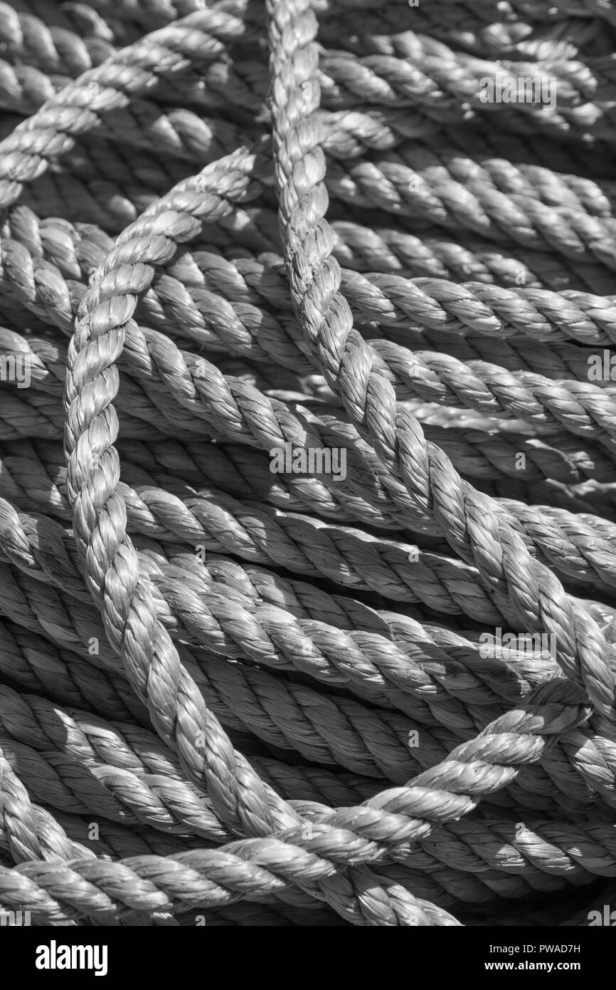 Black and White version of color picture, of pile of fisherman's ropes. Metaphor 'given enough rope'. Rope close up shot. Stock Photo