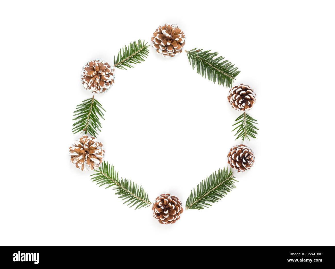 Christmas wreath of pine cones and fir branches isolated on white ...