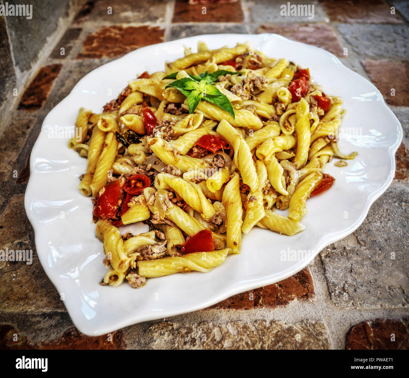 pasta with tuna dish on a rustic wall Stock Photo - Alamy