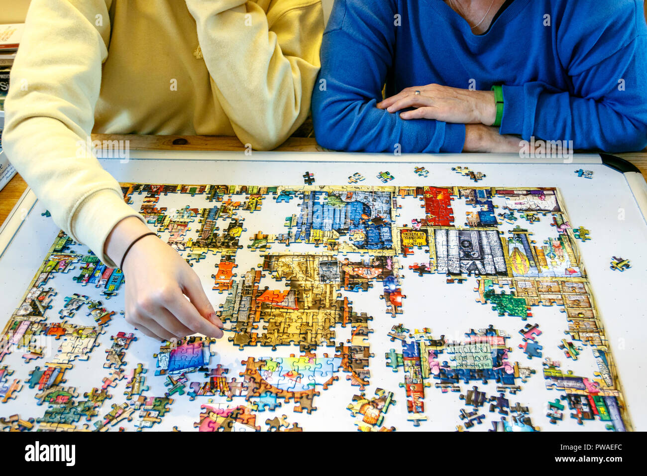 Mother and daughter doing a jigsaw puzzle together Stock Photo Alamy