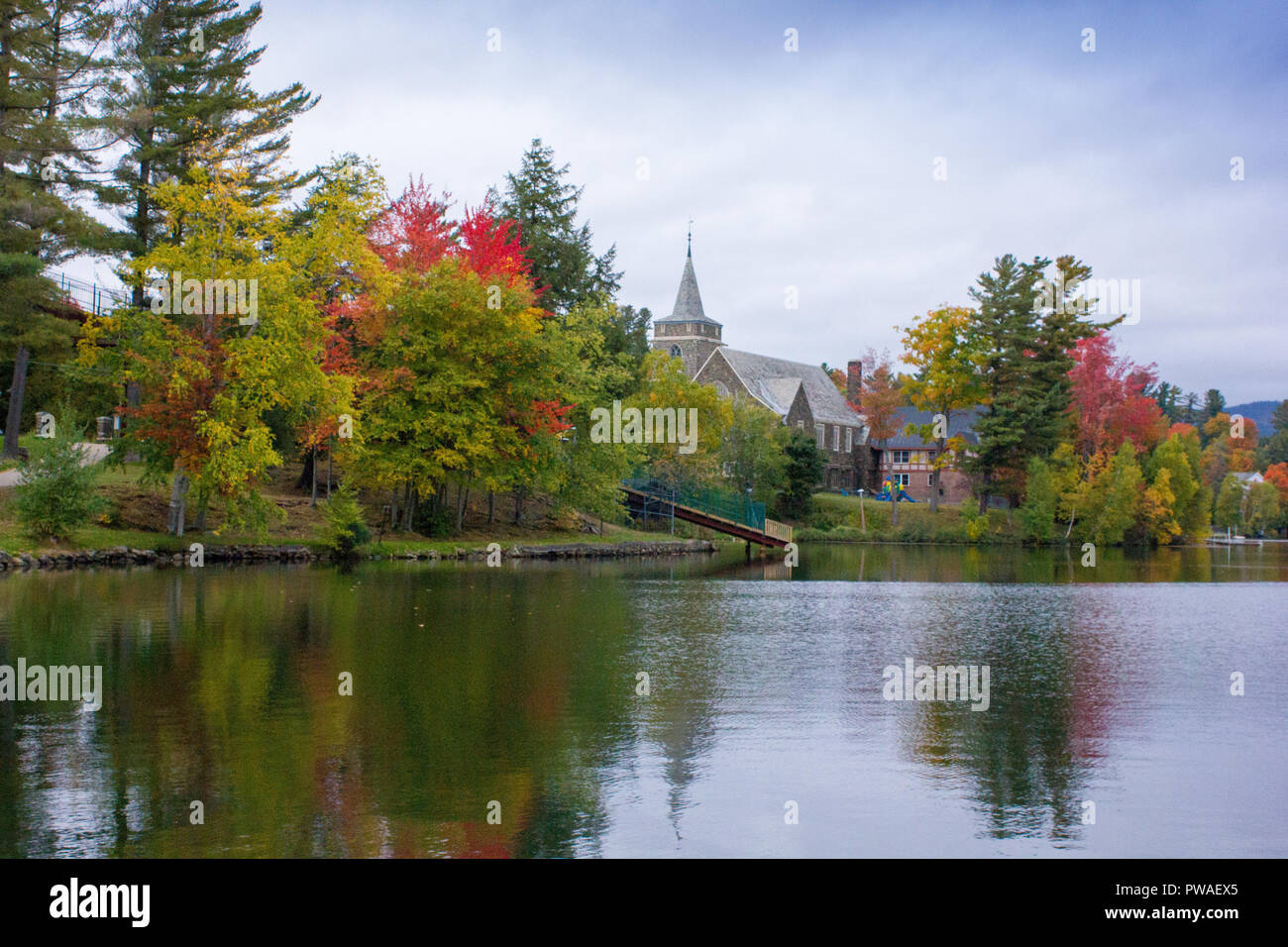 A view of the brilliant and eclectic colors that take over the entire Adirondacks region in New York state of USA during the peak fall season Stock Photo