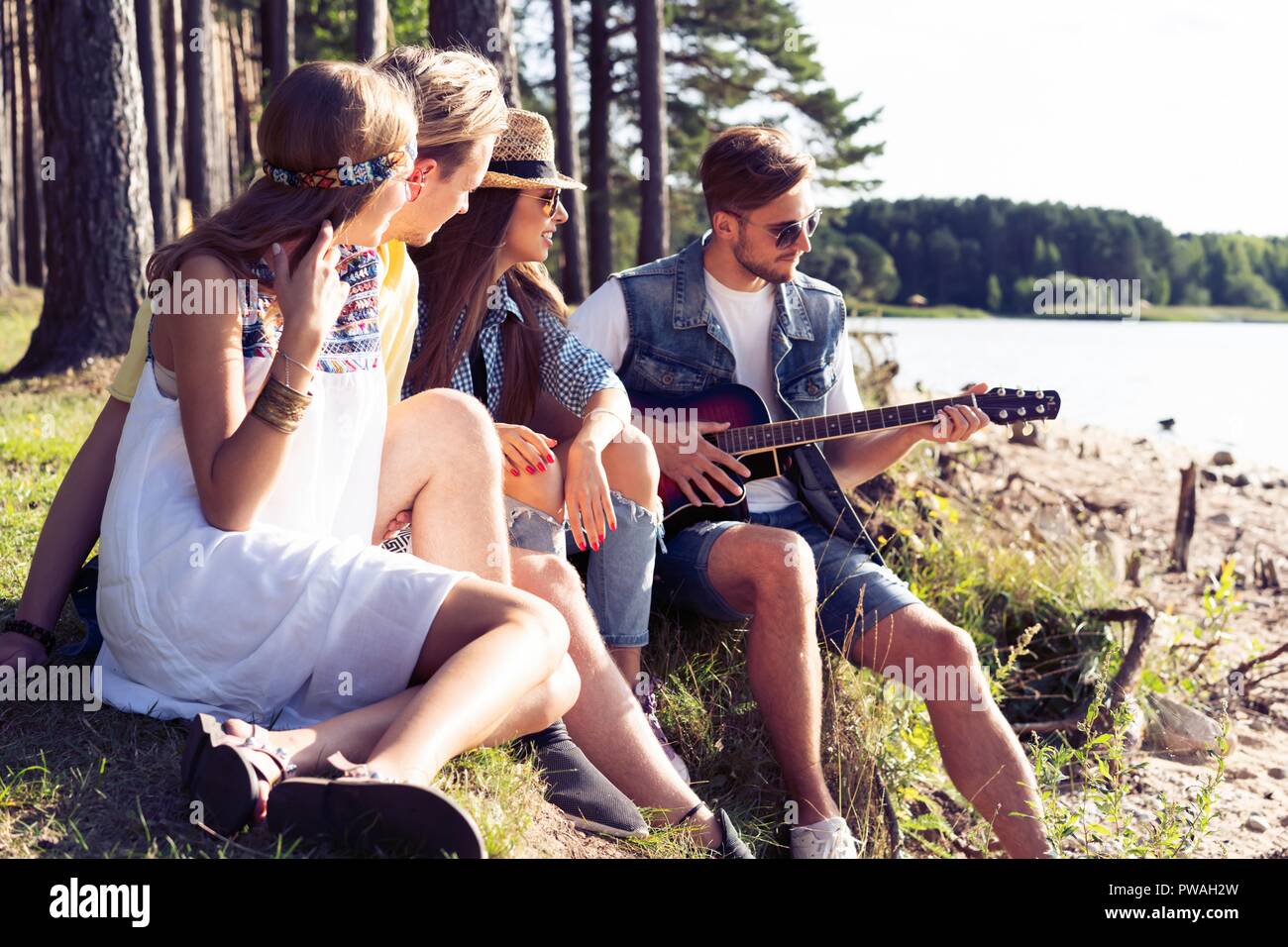 Group teenagers listening music hi-res stock photography and images - Alamy