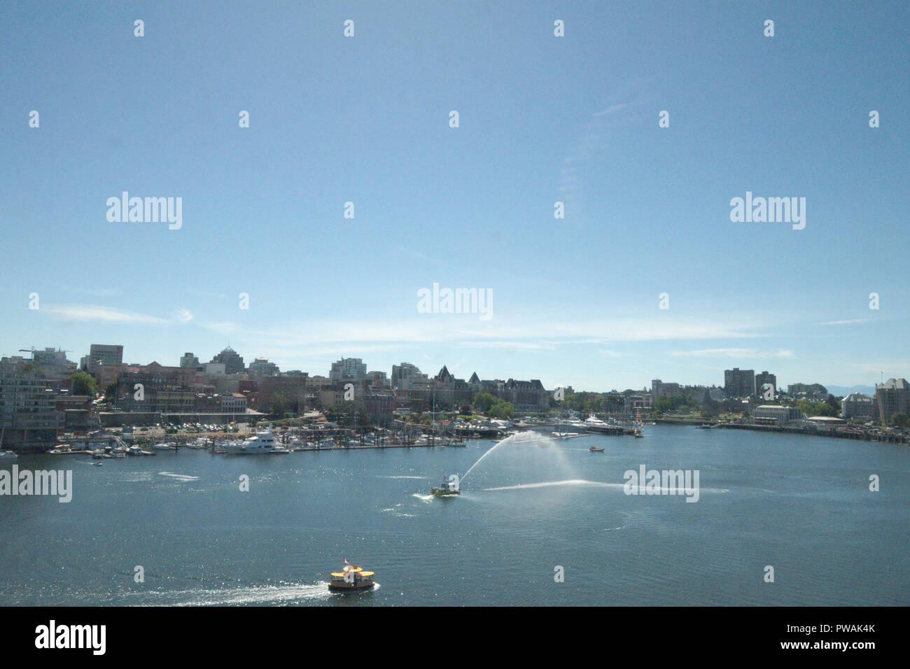 Fire boat spraying in Victoria inner harbour, British Columbia, Canada Stock Photo