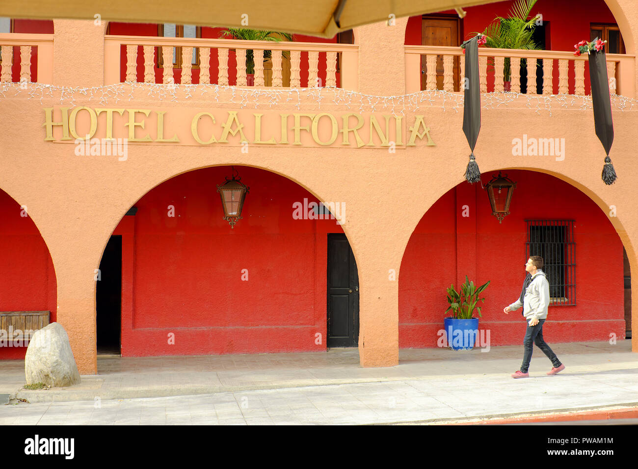 A man walks by the Hotel California in Todos Santos, Mexico. Stock Photo
