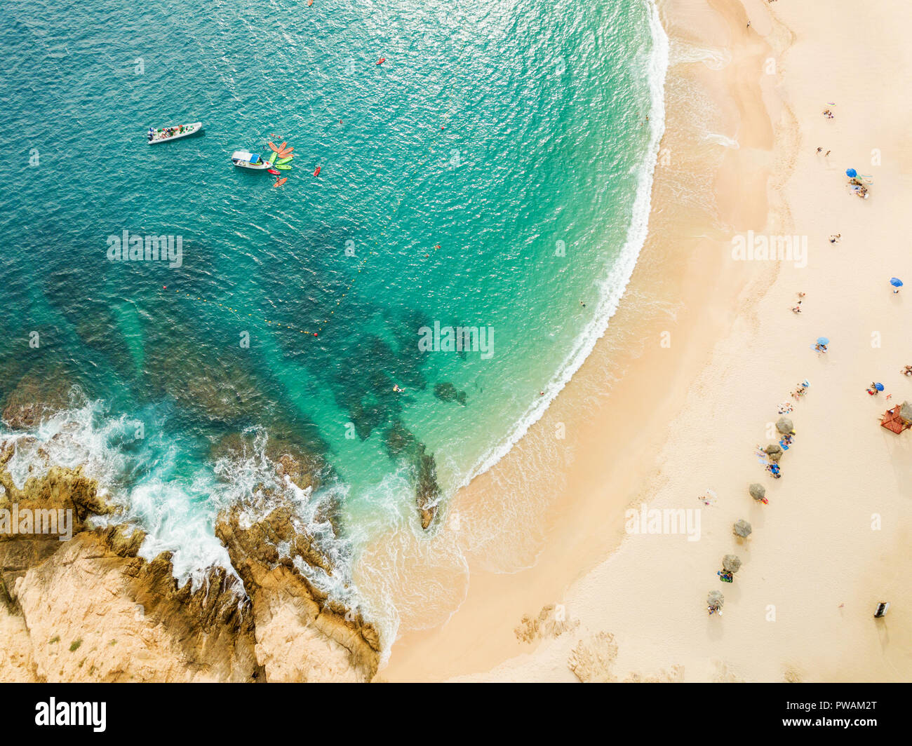 Boats and beachgoers visit Santa Maria Bay near Cabo San Lucas, Mexico. Stock Photo