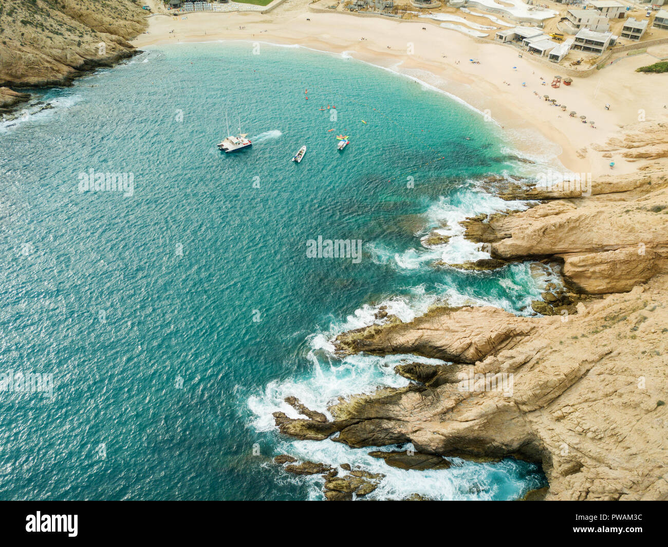 Boats and beachgoers visit Santa Maria Bay near Cabo San Lucas, Mexico. Stock Photo