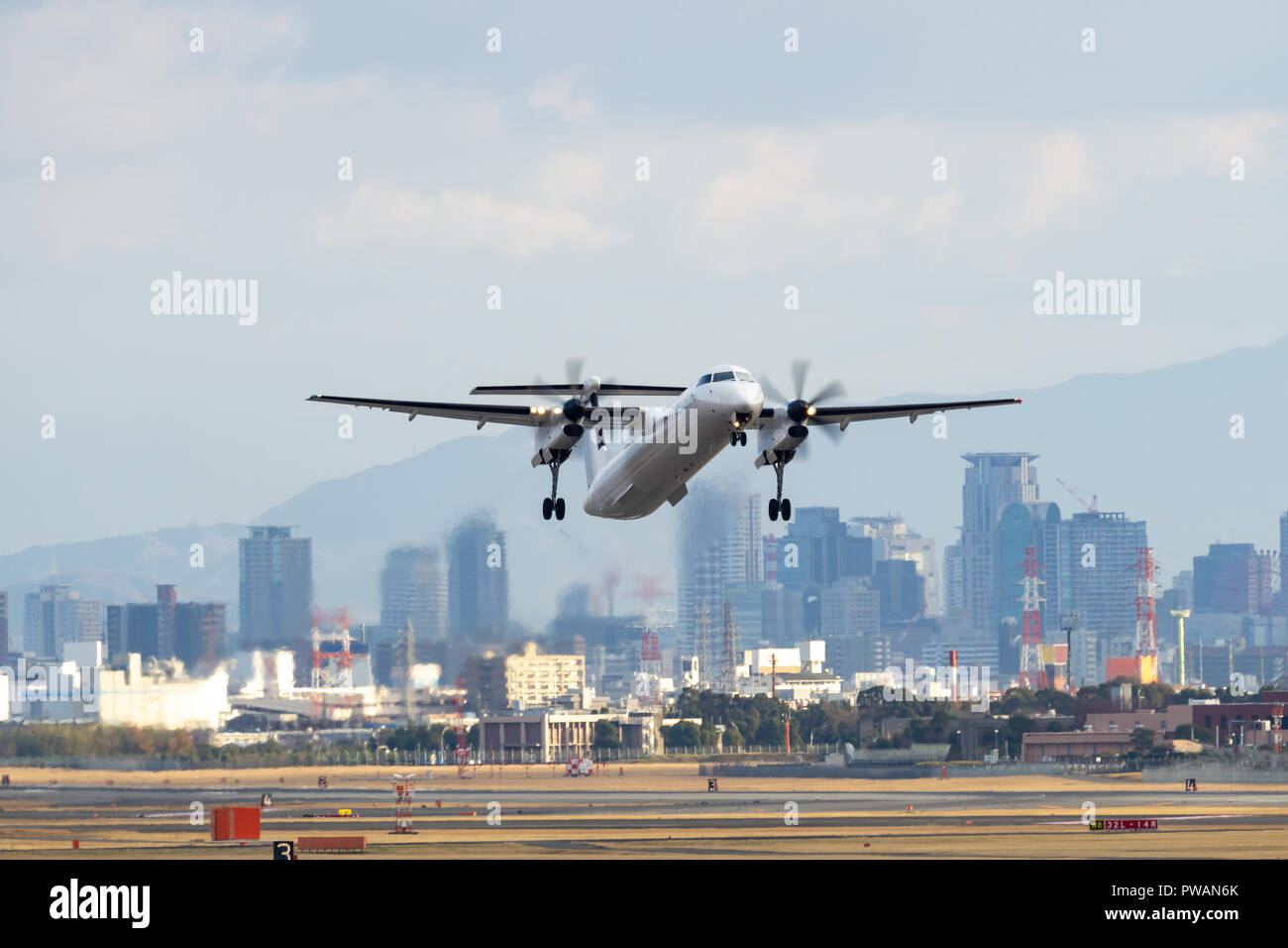 Bombardier DHC-8-Q400 taking off from the airport. Stock Photo