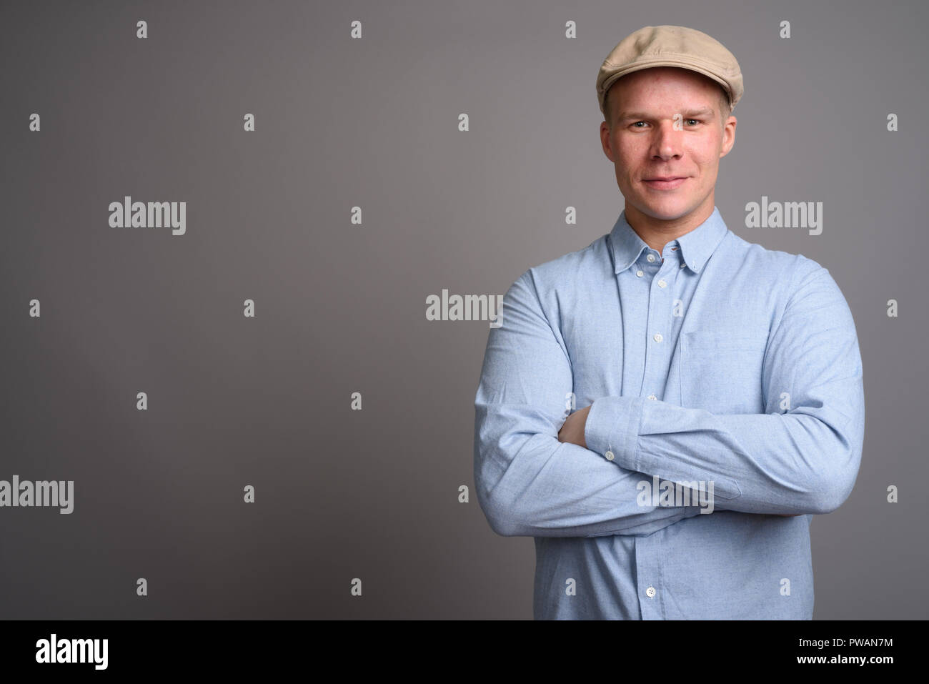 Finnish man wearing hat against gray background Stock Photo