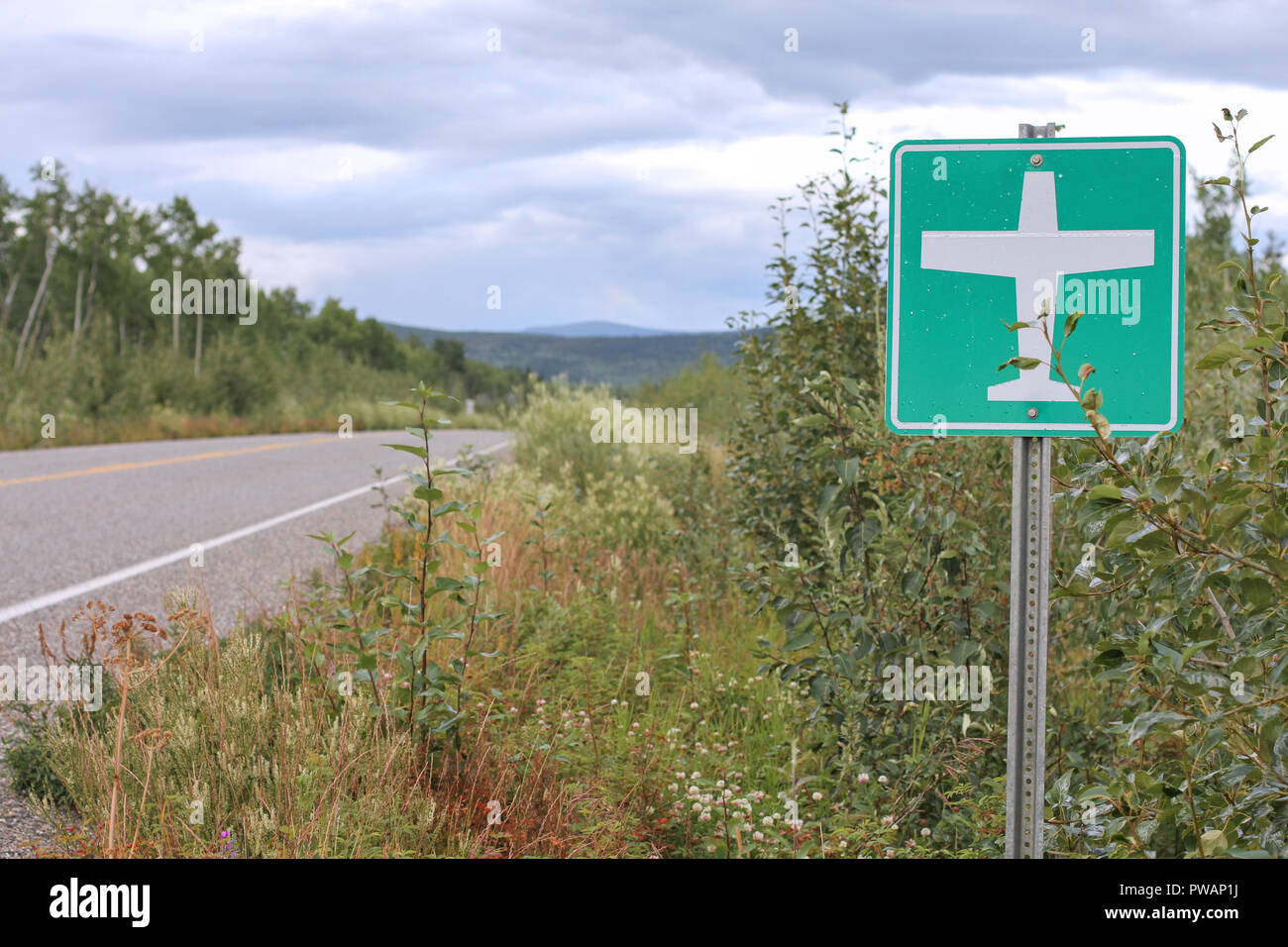 Dalton Highway, Canada. Viewthe road sign that indicates that a strip of the Highway that can be used a landing field or runaway. Stock Photo