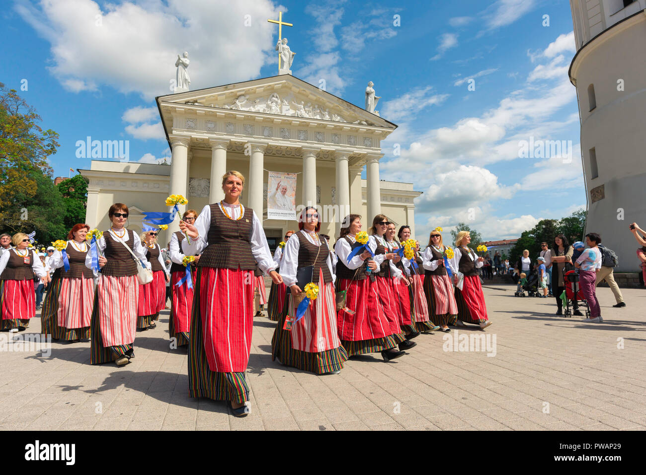 Lithuania festival, view of women wearing traditional costume parading through Cathedral Square in the Lithuania Song and Dance Festival in Vilnius. Stock Photo