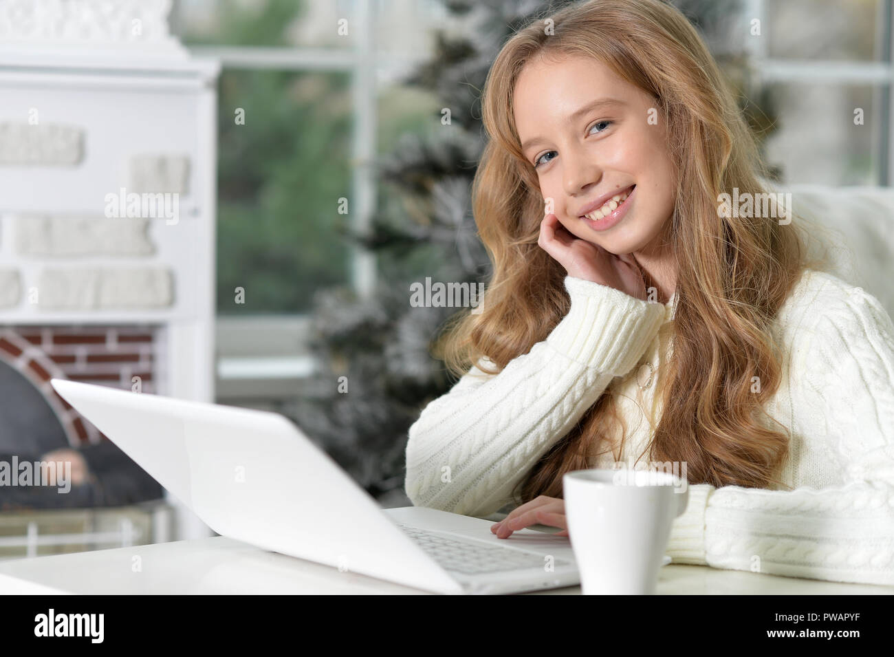 Portrait of a teen girl with laptop Stock Photo - Alamy
