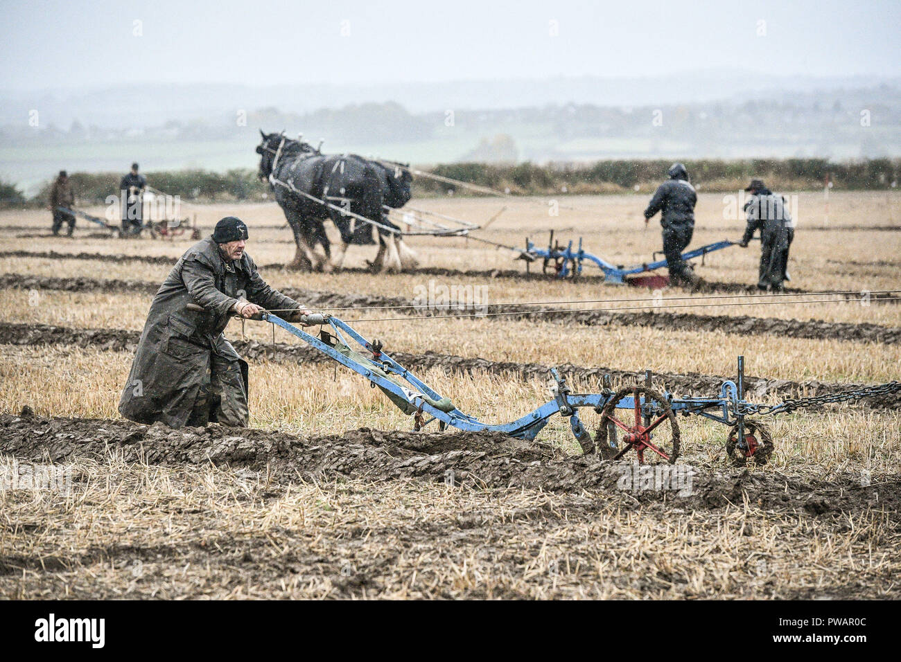 A ploughman wrestles with his plough along the furrow during the 68th