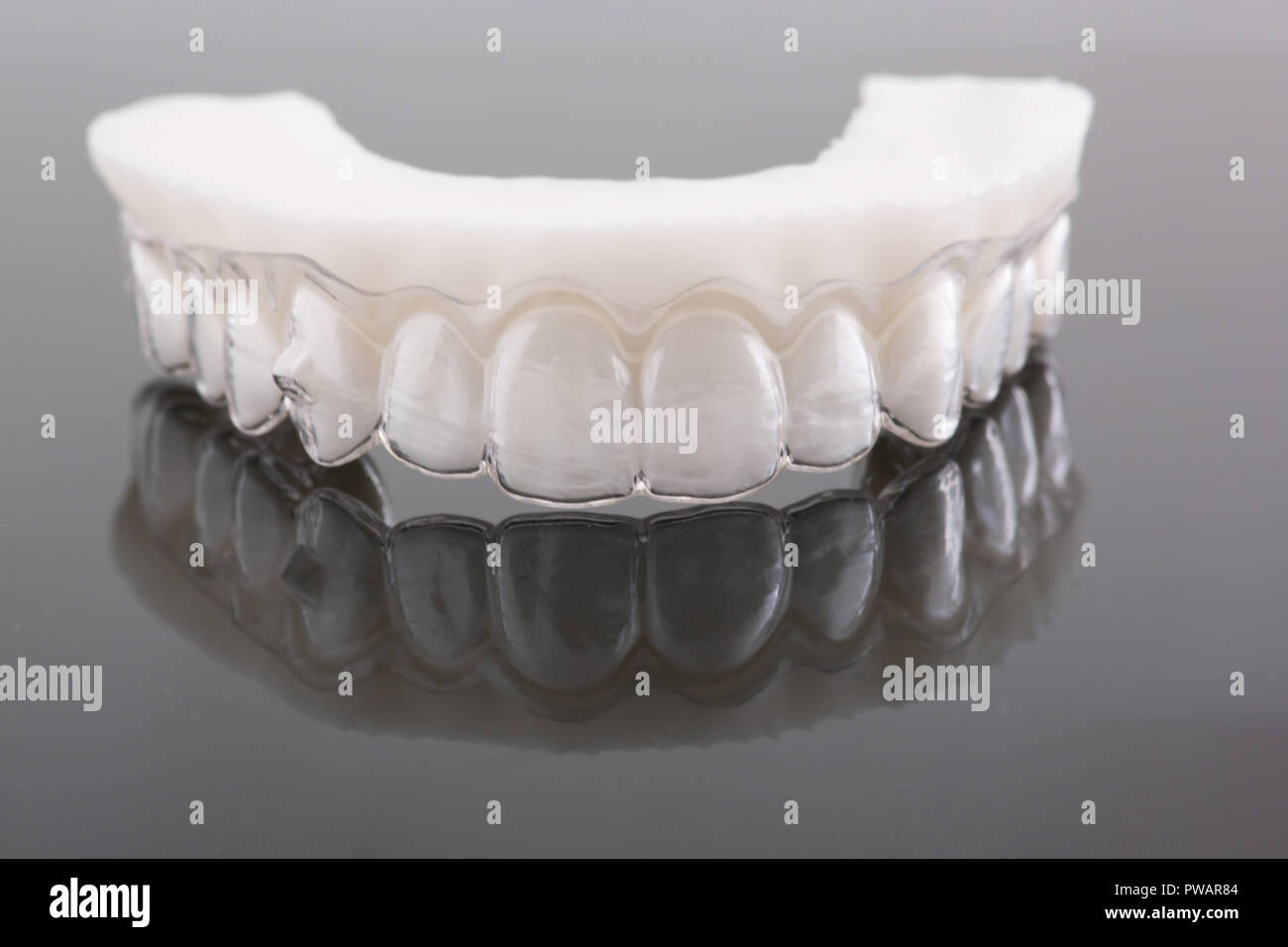 Wax pattern teeth dental crowns on model, metal free front view