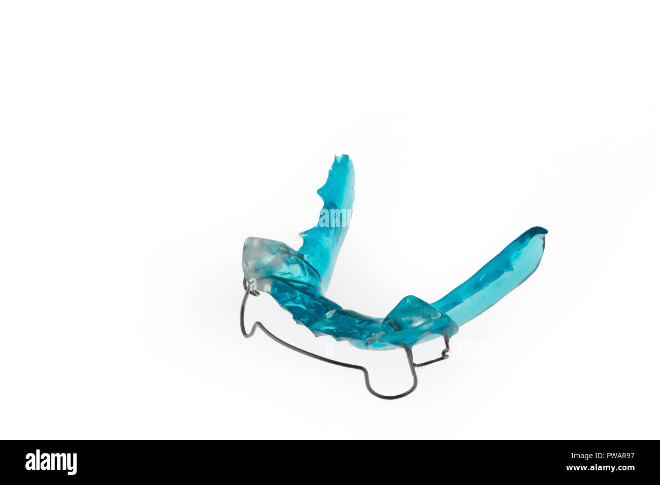 Ortodontic model brace or bracket. Close-up on white background. New dental technology. Modern color. Pleace for text or advertising. Isolated Stock Photo
