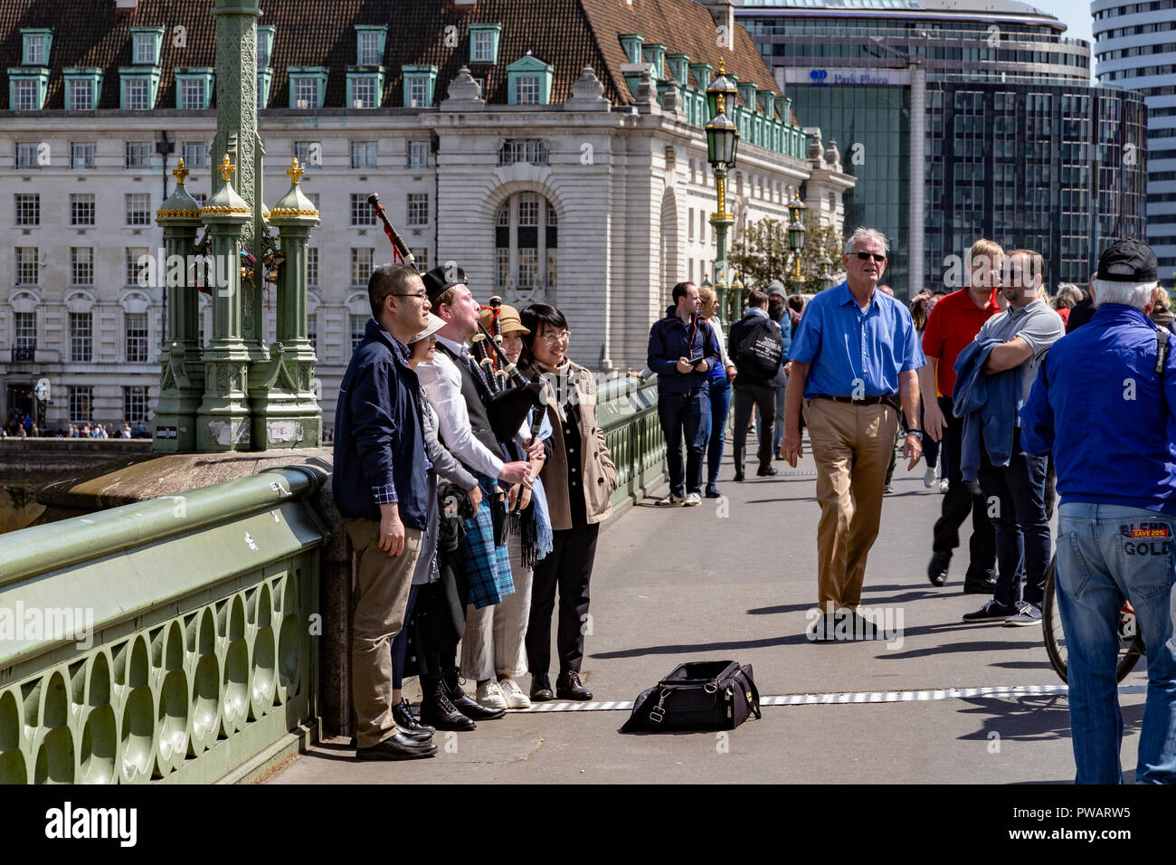 A Man Plays The Bagpipes On Westminster Bridge, London, England Stock