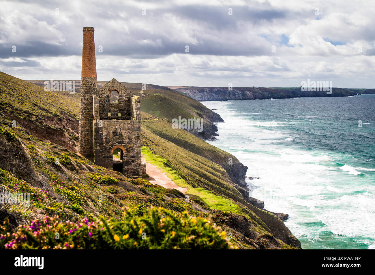 Ruins of Cornish tin mine on rugged coast near St. Agnes, Cornwall, UK Stock Photo