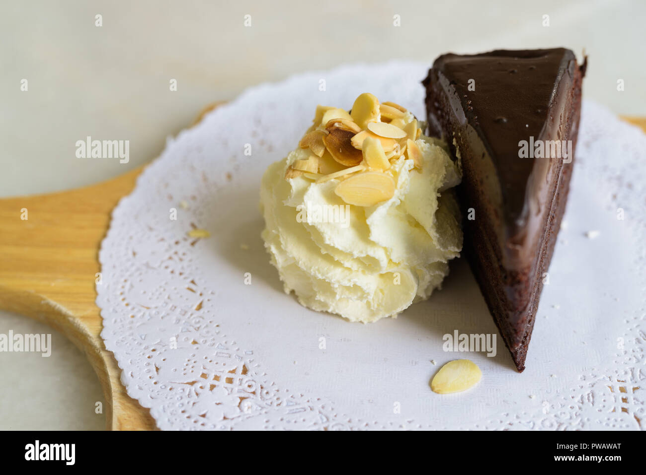 High Angle View Of Chocolate Cake Slice With Whipped Cream Stock Photo