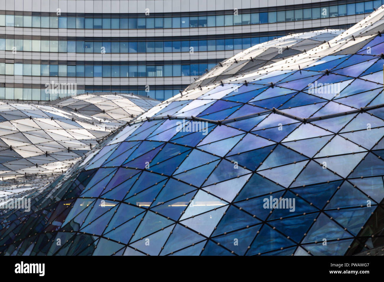 Wide angle abstract background view of steel light blue high rise ...