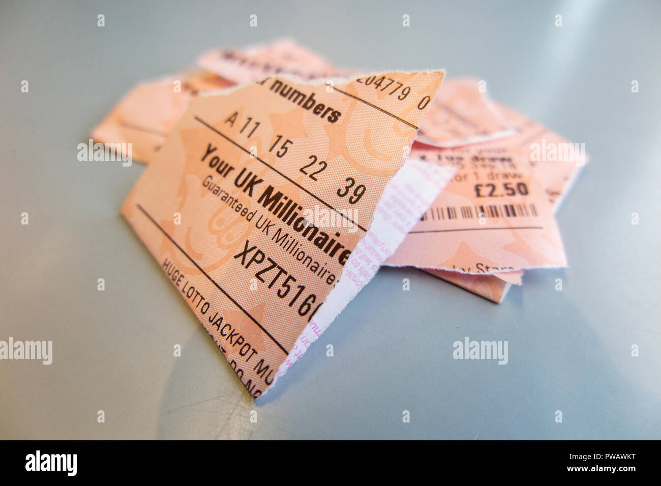 A torn up lottery ticket, shredded into many pieces Stock Photo
