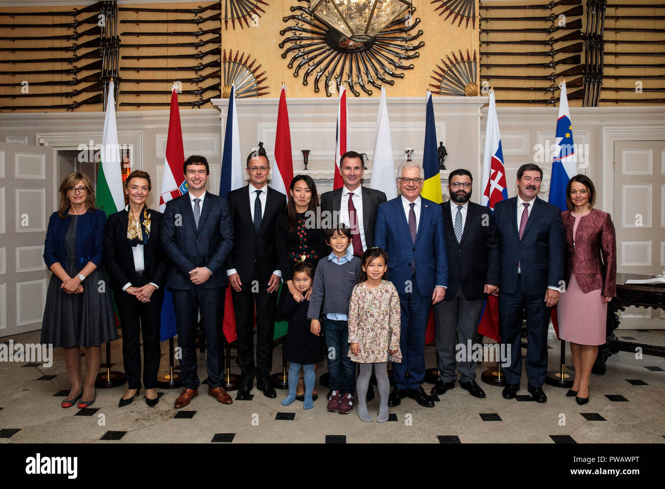 (left to right) Bulgarian Foreign Minister Ekaterina Zaharieva, Croatian Deputy Prime Minister and Foreign Minister Marija Pejcinovic Buric, Czech Republic Deputy Foreign Minister Lukas Kaucky, Hungarian Foreign Minister Peter Szijjarto, Lucia Hunt, her husband British Foreign Secretary Jeremy Hunt and their children Ellie, aged 4, Jack, aged 8 and Anna, aged 6, Polish Foreign Minister Jacek Czaputowicz, Romanian State Secretary Danut Neculaescu, Slovakian Europe Minister Frantisek Ruzicka and Slovenian State Secretary Simona Leskovar pose for a photograph at Chevening House at Chevening House Stock Photo