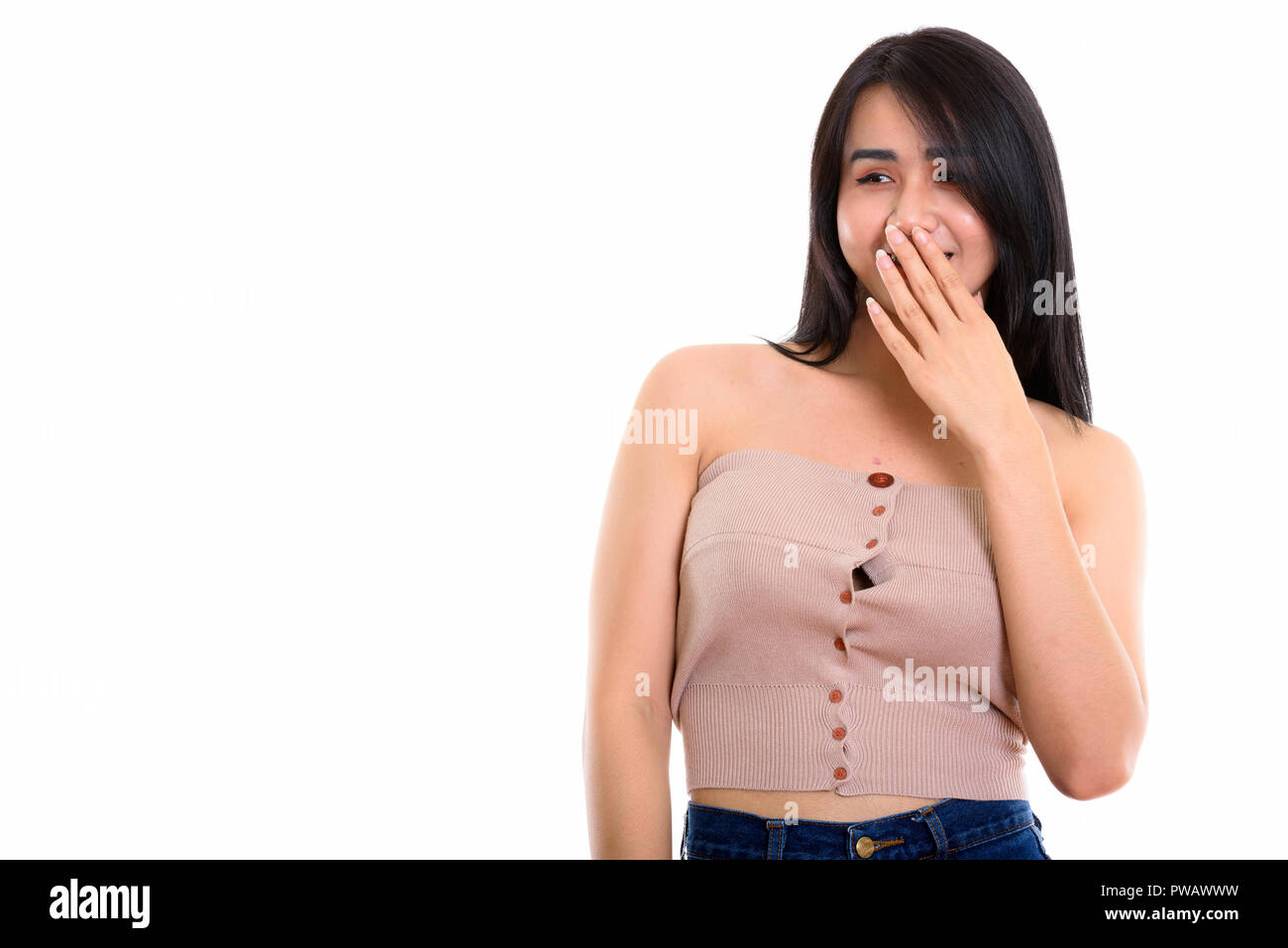 Thoughtful happy Asian transgender woman smiling while laughing  Stock Photo