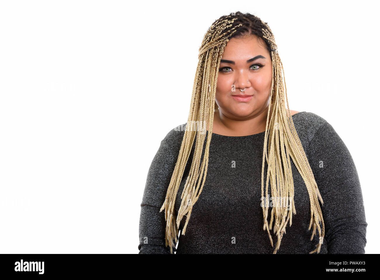 Studio shot of young fat Asian woman Stock Photo