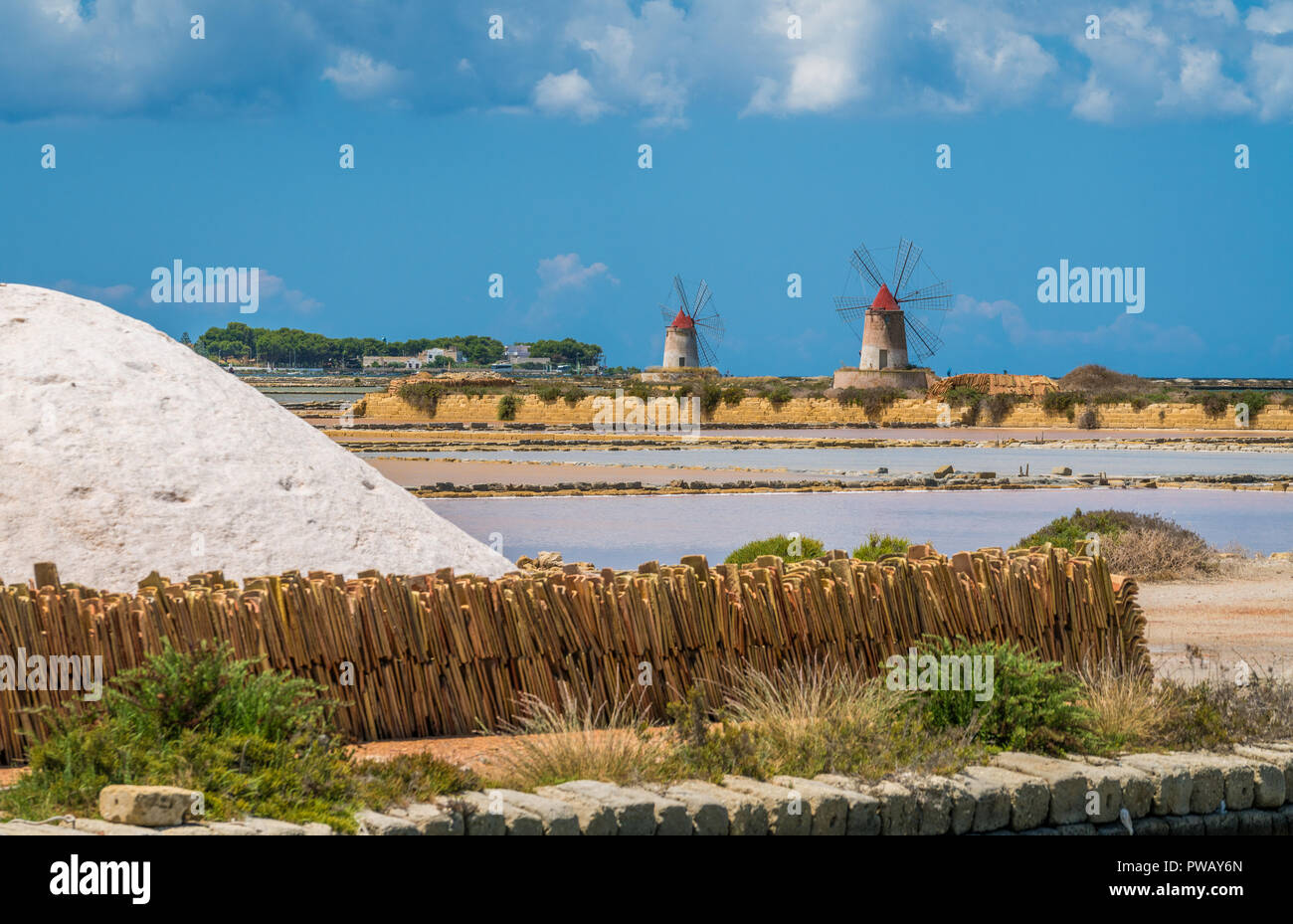 Windmills at the natural reserve of the 'Saline dello Stagnone' near Marsala and Trapani, Sicily. Stock Photo