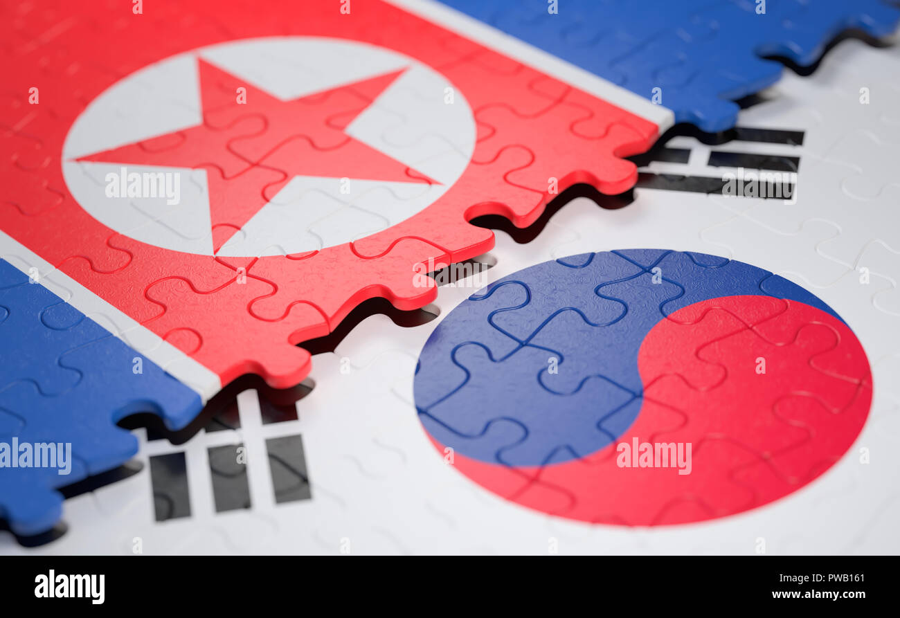 Two nations joining in a puzzle game that represents union, peace, commerce, social and human agreement. For peace and well-being of nations in the wo Stock Photo