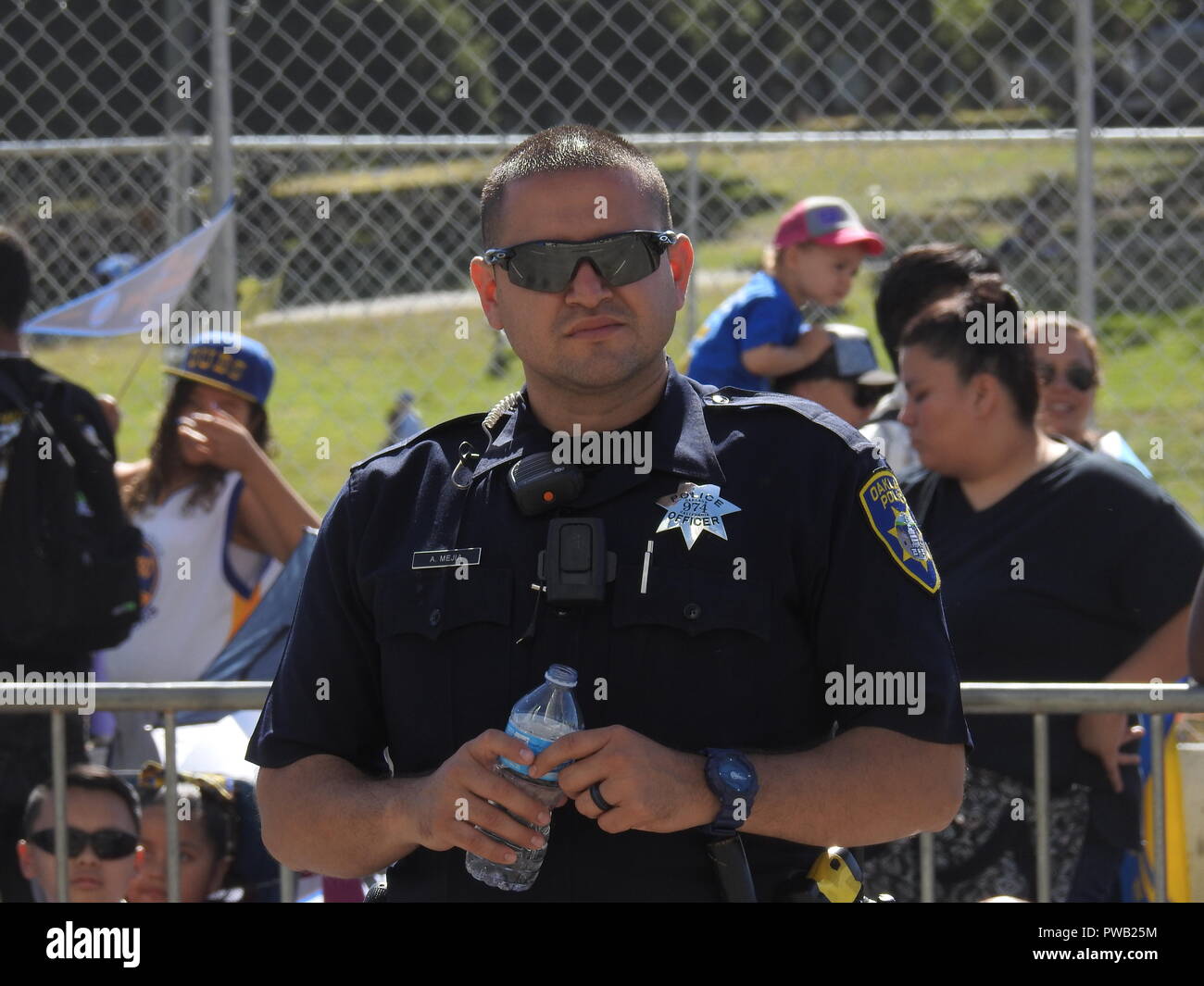 Oakland police Officer Alexis Mejia provides security at the Golden State Warriors victory parade in Oakland on June 15, 2017. Stock Photo