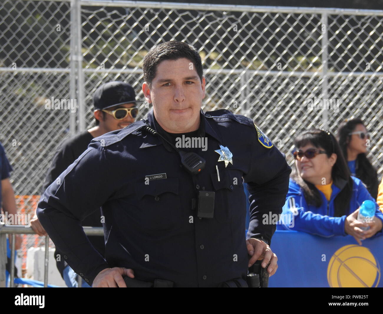 Oakland police Officer Jacob Loredo provides security at the Golden State Warriors victory parade in Oakland on June 15, 2017. Stock Photo