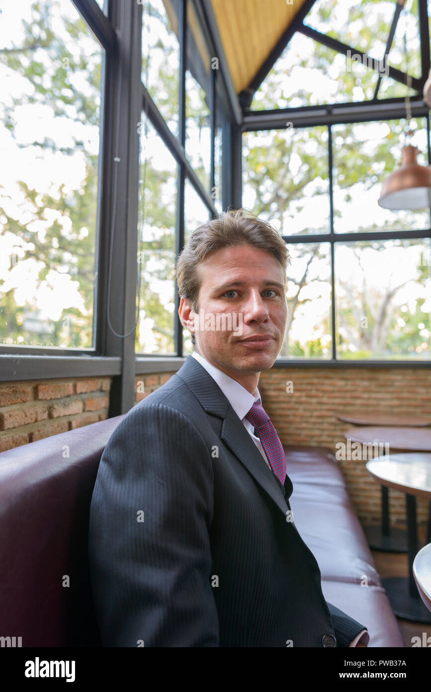 Businessman sitting and having break at the cafe Stock Photo