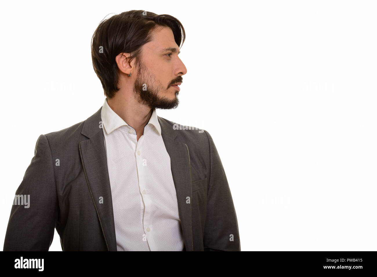 Profile view of handsome businessmann against white background Stock Photo
