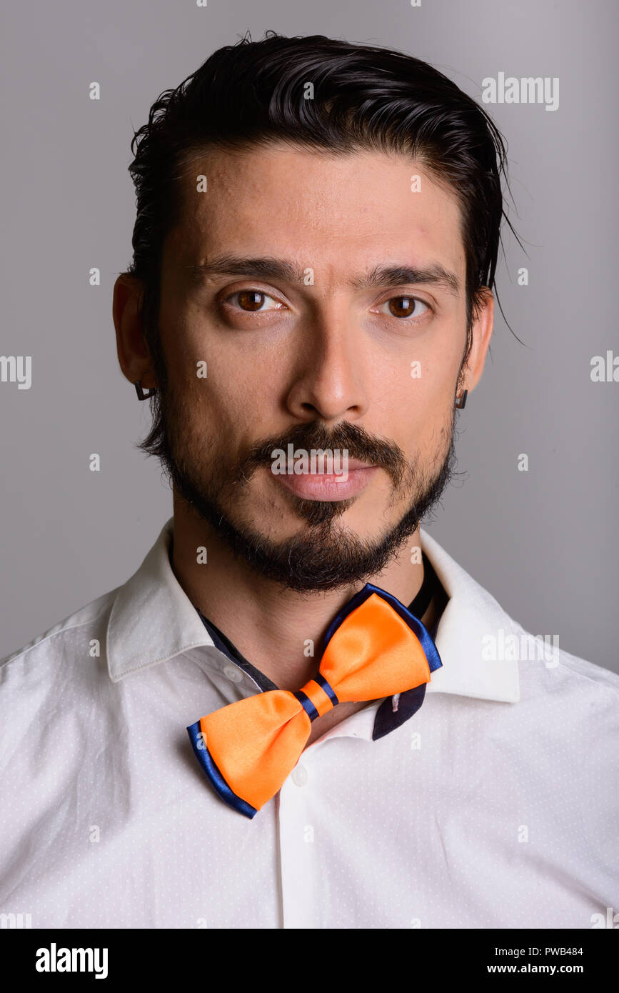 Face of handsome man with crooked bow tie Stock Photo