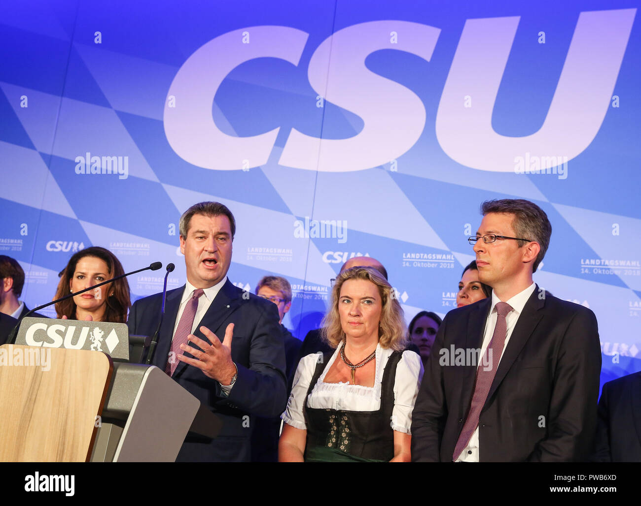 Munich, Germany. 14th Oct, 2018. German Christian Social Union's candidate and Bavarian governor Markus Soeder (3rd R, Front) delivers a speech after the initial forecast at the Maximilianeum in Munich, Germany, on Oct. 14, 2018. The Christian Social Union (CSU), one of the three ruling parties in Germany, suffered great loss Sunday in the state election in Bavaria, according to the initial forecast by the public broadcasters ARD and ZDF. Credit: Shan Yuqi/Xinhua/Alamy Live News Stock Photo