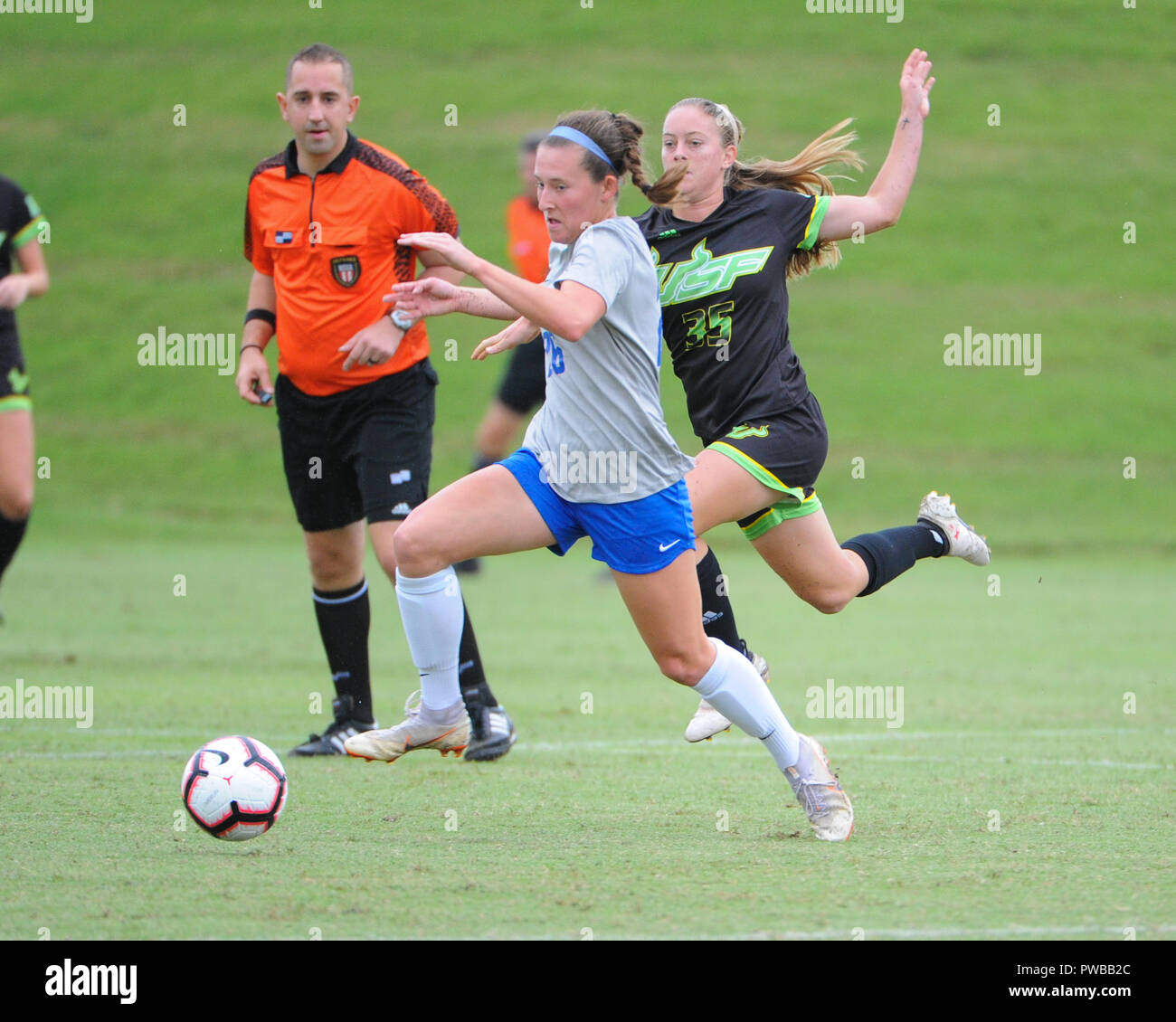 Memphis, TN, USA. 14th Oct, 2018. Memphis Tigers defender, STASIA MALLIN (26), moves the ball downfield as Central Florida midfielder, SYDNEY NASELLO (35), follows close behind, during the NCAA soccer game between the Memphis Tigers and the South Florida Bulls at Mike Rose Soccer Complex in Memphis, TN. USF defeated Memphis, 2-0. Kevin Langley/CSM/Alamy Live News Stock Photo