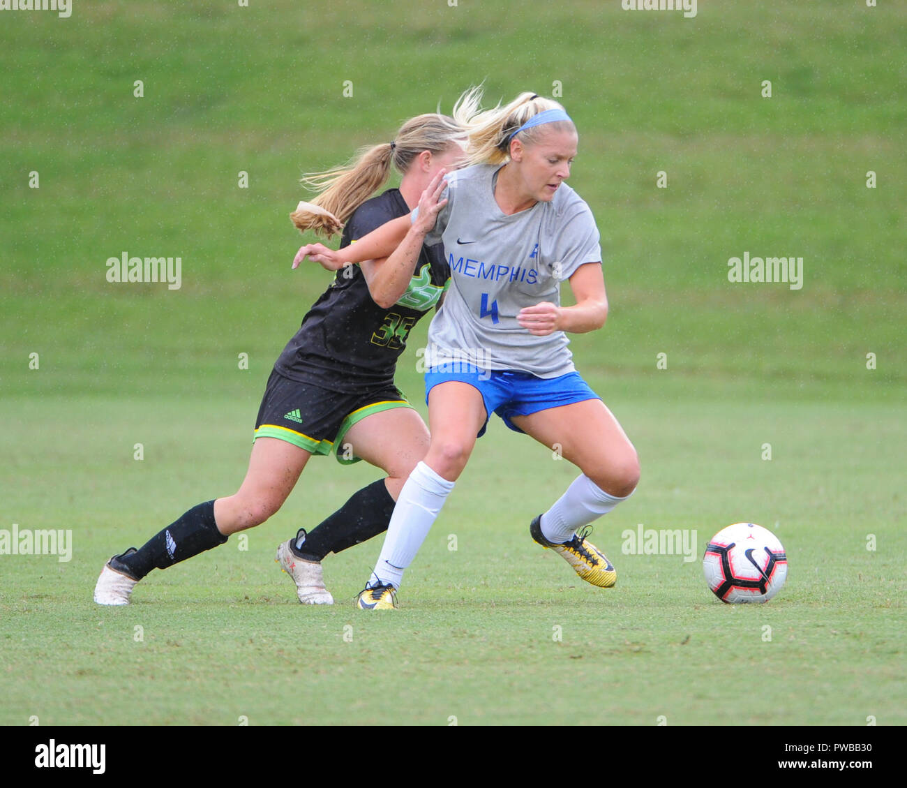 Memphis, TN, USA. 14th Oct, 2018. Memphis Tigers forward, ELIZABETH WOERNER (4), and Central Florida midfielder, SYDNEY NASELLO (35), battle for control of the ball, during the NCAA soccer game between the Memphis Tigers and the South Florida Bulls at Mike Rose Soccer Complex in Memphis, TN. USF defeated Memphis, 2-0. Kevin Langley/CSM/Alamy Live News Stock Photo