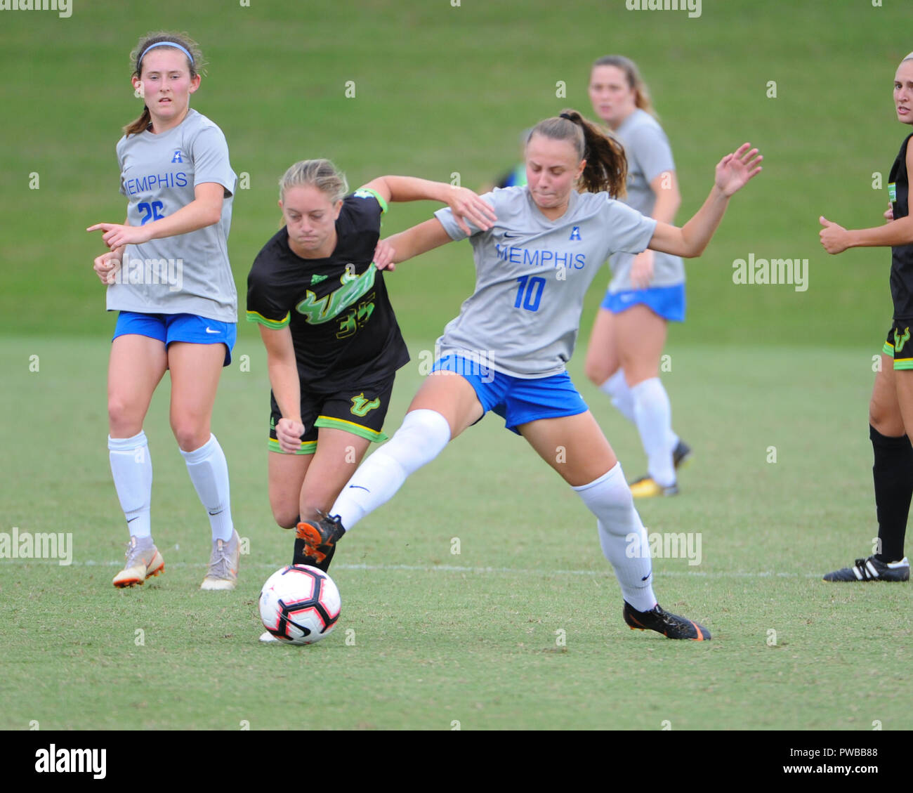 Memphis, TN, USA. 14th Oct, 2018. Memphis Tigers forward, JESSICA LISI (10), and Central Florida midfielder, SYDNEY NASELLO (35), fight for control of the ball, during the NCAA soccer game between the Memphis Tigers and the South Florida Bulls at Mike Rose Soccer Complex in Memphis, TN. USF defeated Memphis, 2-0. Kevin Langley/CSM/Alamy Live News Stock Photo