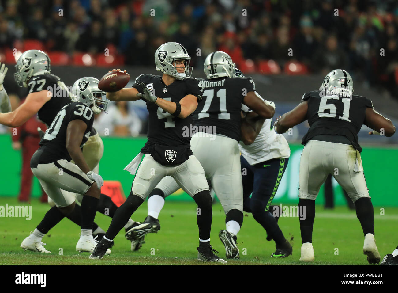 Wembley Stadium, London, UK. 14th Oct, 2018. NFL in London, game one, Seattle Seahawks versus Oakland Raiders; Quarterback Derek Carr of the Oakland Raiders Credit: Action Plus Sports/Alamy Live News Stock Photo