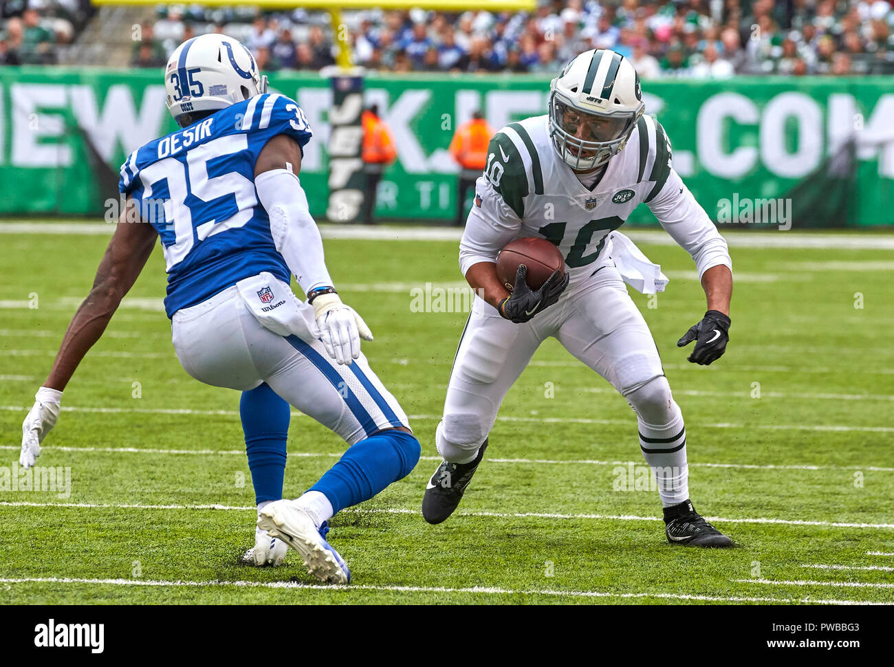 East Rutherford, New Jersey, USA. 14th Oct, 2018. New York Jets wide  receiver Jermaine Kearse (10) looks for running room as Indianapolis Colts  defensive back Pierre Desir (35) defends during a NFL