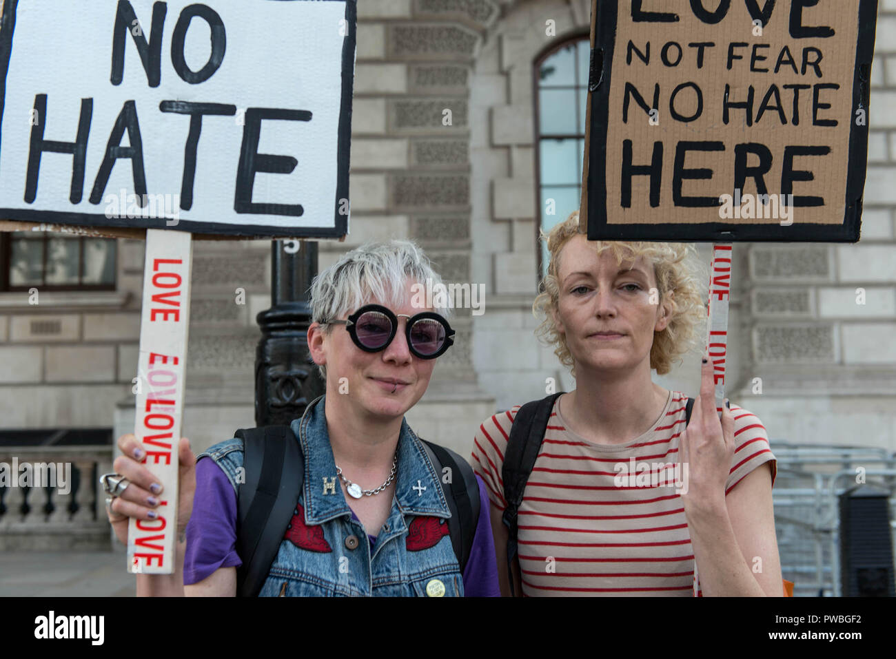 London, Greater London, UK. 13th Oct, 2018. Protesters seen holding placards during the antifascist demonstration against the DFLA in London.Counter demonstration organised by United Against Racism & Islamophobia, Trade Unions and Stand Up to Racism marched from Old Palace Yard to Whitehall in an attempt to block the route of Democratic Football Lads Alliance (DFLA) march in London. During the counter demonstration there were incidents where DFLA supporters attempted to get close to the anti-racist protesters, that were controlled by the police. (Credit Image: © Andres Pantoja Stock Photo