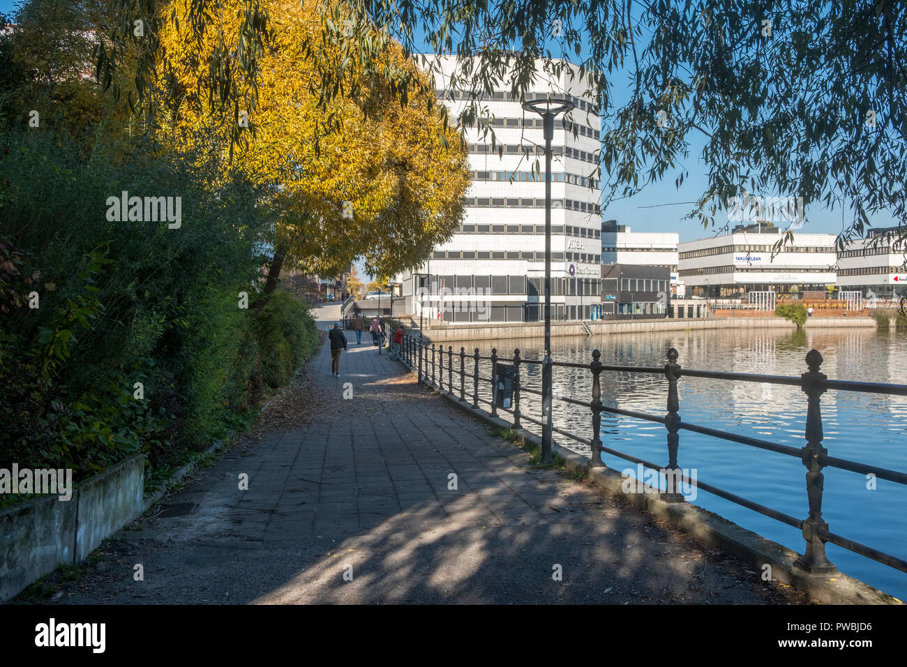 Norrköping waterfront and Motala stream during a warm and sunny autumn day. Norrkoping is a historic industrial town in Sweden. Stock Photo
