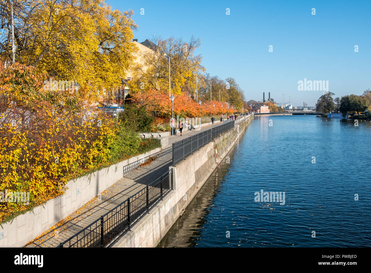 Norrköping waterfront Saltängen and Motala stream during a warm and sunny autumn day. Norrkoping is a historic industrial town in Sweden. Stock Photo