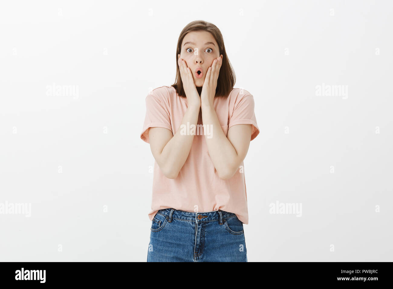 Amazed And Fascinated Cute Girl With Short Haircut In Casual