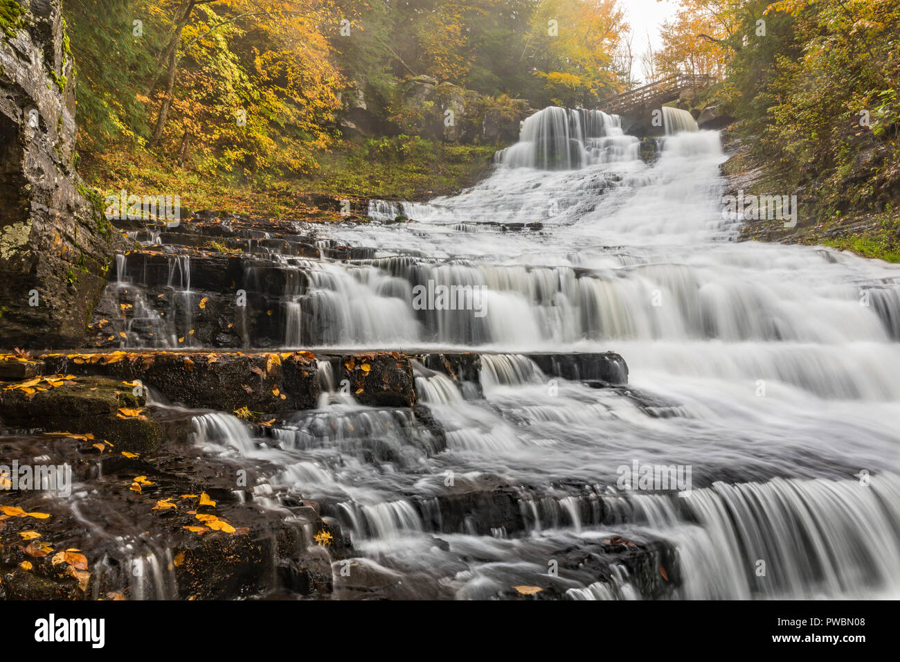 A misty, rainy Autumn afternoon at Rensselaerville Falls in the Huyck